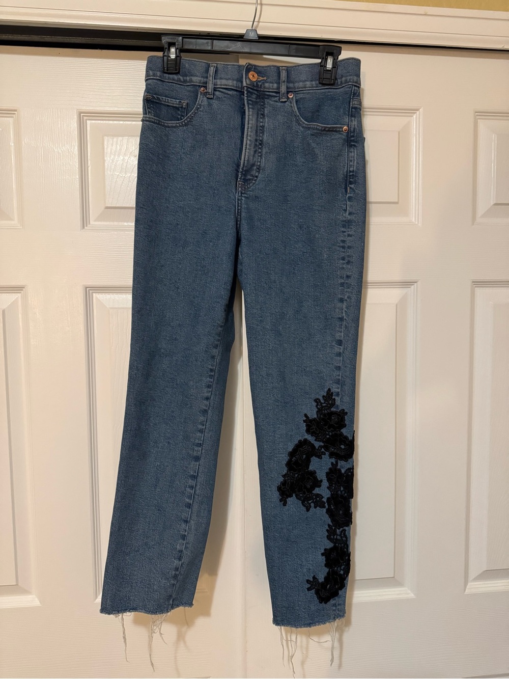 Express Blue Straight-Leg Jeans with Black Floral Applique